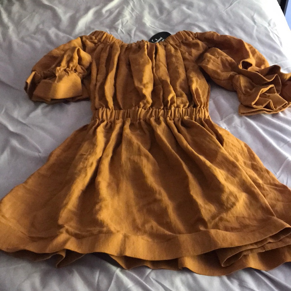 Ruffle sleeved dress in tan orange color